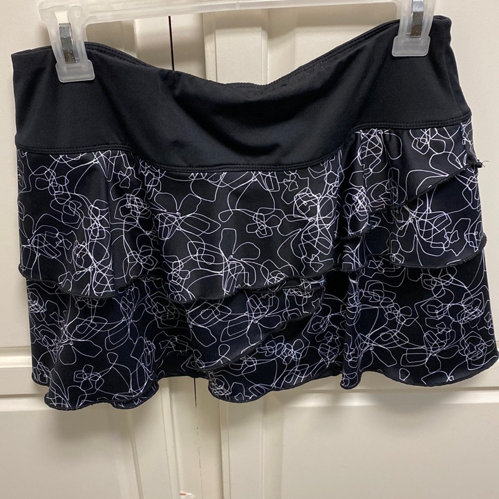 Fila, tiered tennis skirt with black shorts. Size medium.
